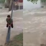 Viral Video: రీల్స్ కోసం భారీ వరదల్లో యువకుడి విన్యాసాలు..