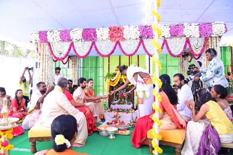 Actors Vijay Deverakonda and Rashmika Mandanna participating in a traditional Satyanarayana Swamy Vratam ceremony at their ancestral village.