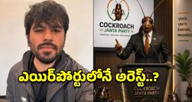 మద్యం బాటిళ్ల లారీ బోల్తా.. ఎగబడ్డ జనం